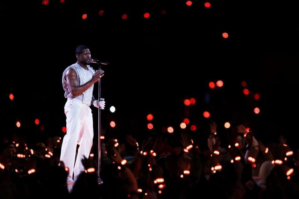 Usher performs onstage at Allegiant Stadium.