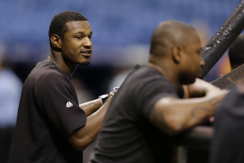 Adam Jones (left) and Delmon Young. (AP)