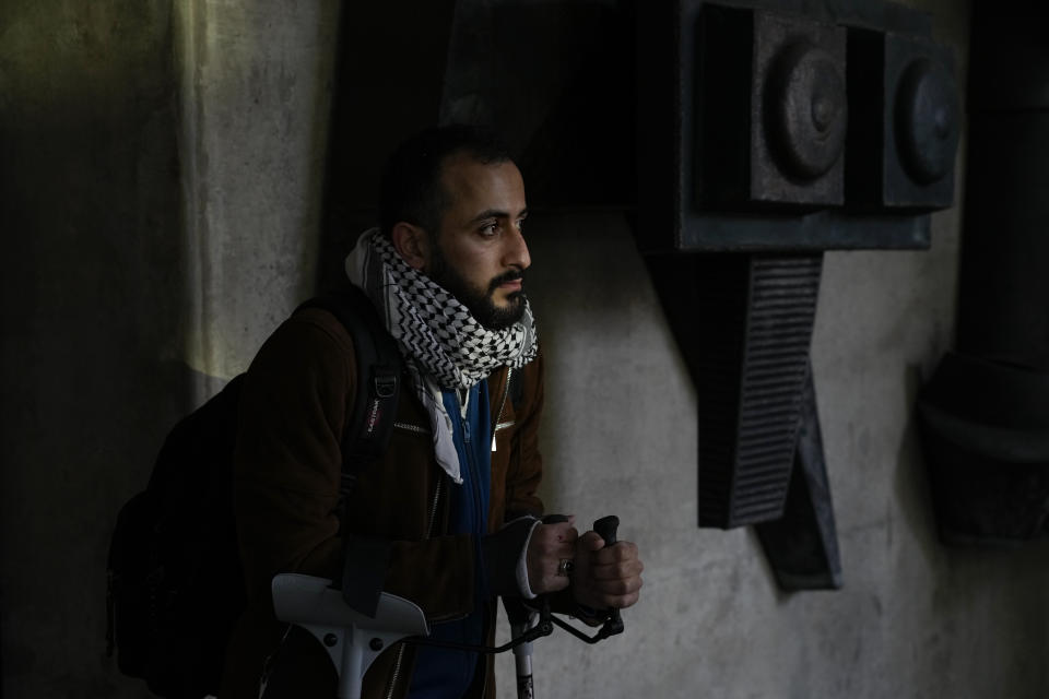 A supporter of Ismail Ziada waits outside the court building after a Dutch appeals court in The Hague Tuesday, Dec. 7, 2021, upheld a lower court's decision to throw out a civil case against Israel's defense minister Benny Gantz and another former senior military officer over their roles in a deadly 2014 airstrike in Gaza which killed six members of the Ziada family. (AP Photo/Peter Dejong)