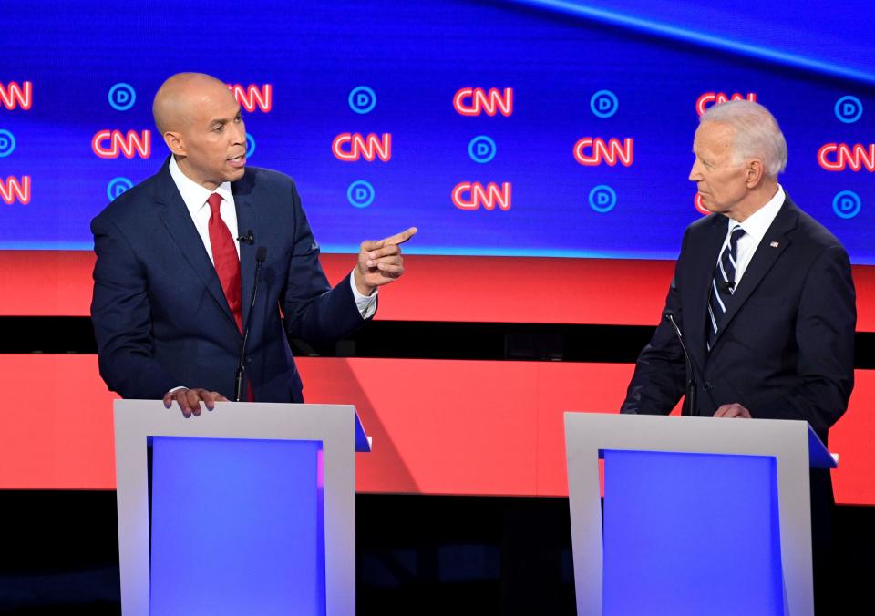 Democratic presidential hopefuls US Senator from New Jersey Cory Booker (L) and Former Vice President Joe Biden (R) speak during the second round of the second Democratic primary debate of the 2020 presidential campaign season hosted by CNN at the Fox Theatre in Detroit, Michigan on July 31, 2019. (Photo by Jim WATSON / AFP)JIM WATSON/AFP/Getty Images