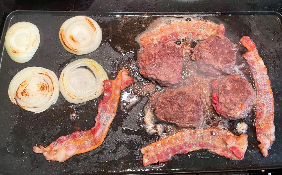 Cooking patties and toppings for Gordon Ramsay's Burger