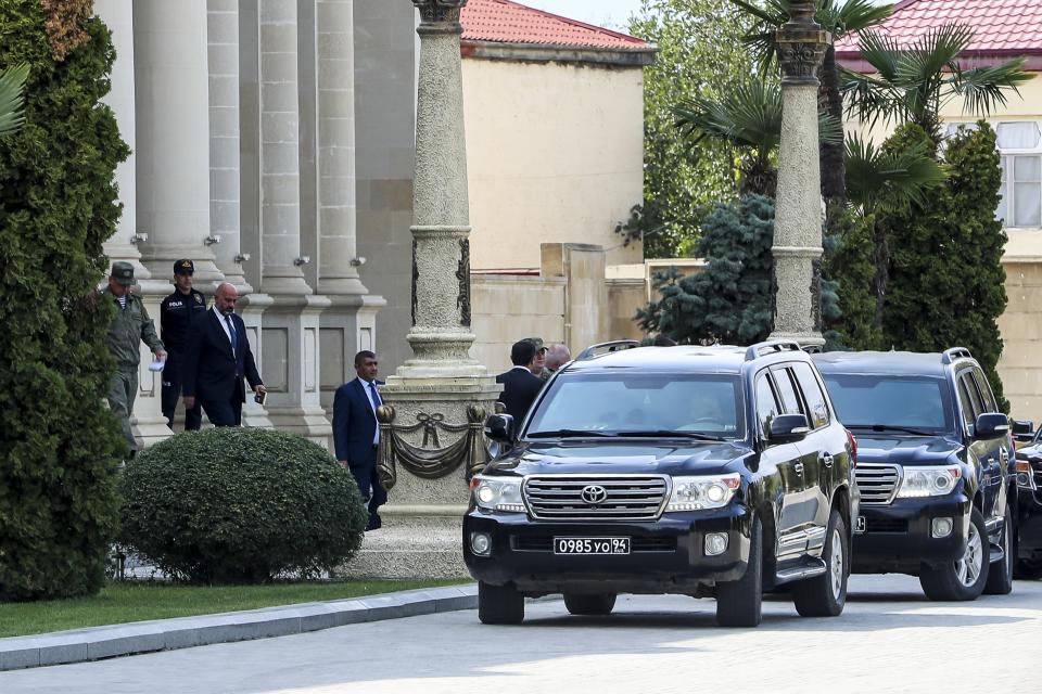 Representatives of the Armenian community of Nagorno-Karabakh leave the building after the talks in the Azerbaijani city of Yevlakh, Azerbaijan, Thursday, Sept. 21, 2023. Talks are expected between Azerbaijan and separatist officials from Nagorno-Karabakh a day after Baku and Armenian forces reached a cease-fire agreement to end two days of fighting in the separatist region that has been a flashpoint for decades. (AP Photo)