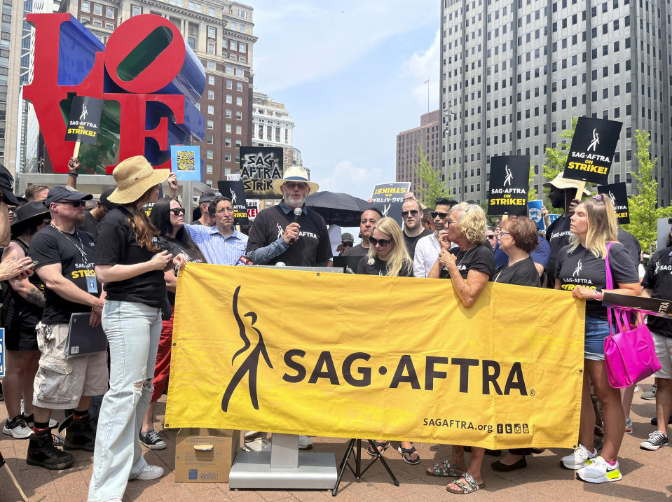 Actor David Morse speaks at a rally in support of the actors and writers strikes at Love Park in Philadelphia on Thursday, July 20, 2023. The actors strike comes more than two months after screenwriters began striking in their bid to get better pay and working conditions. (AP Photo/Tassanee Vejpongsa)