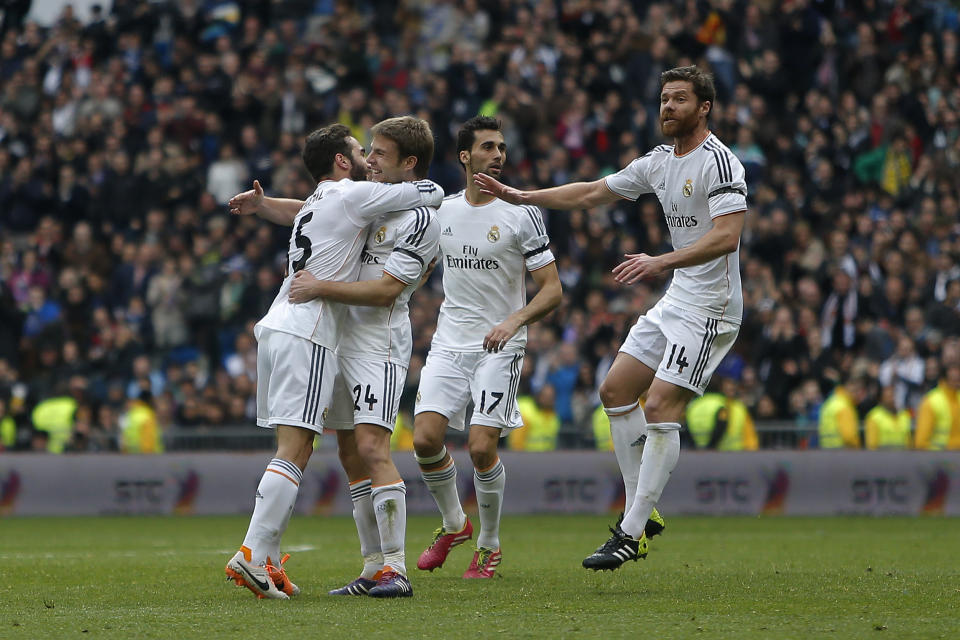 Real Madrid's Asier Illarramendi, second left, celebrates his goal with team mates during a Spanish La Liga soccer match between Real Madrid and Elche at the Santiago Bernabeu stadium in Madrid, Spain, Saturday, Feb. 22, 2014. (AP Photo/Andres Kudacki)