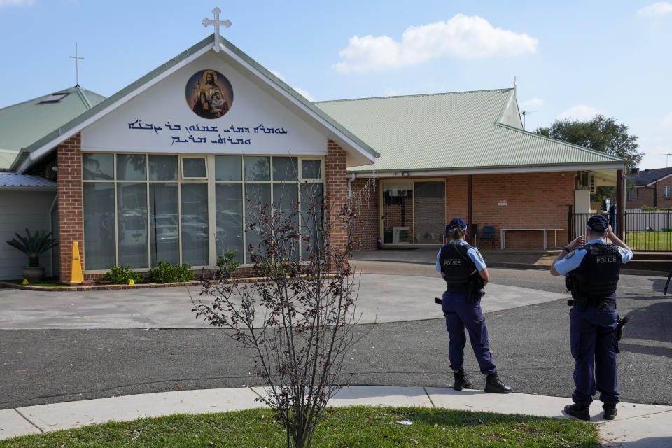 Police patrol outside the Christ the Good Shepherd church in suburban Wakely in western Sydney, Australia, Tuesday, April 16, 2024. Australian police say a knife attack in Sydney that wounded a bishop and a priest during a church service as horrified worshippers watched online and in person, and sparked a riot was an act of terrorism.(AP Photo/Mark Baker)