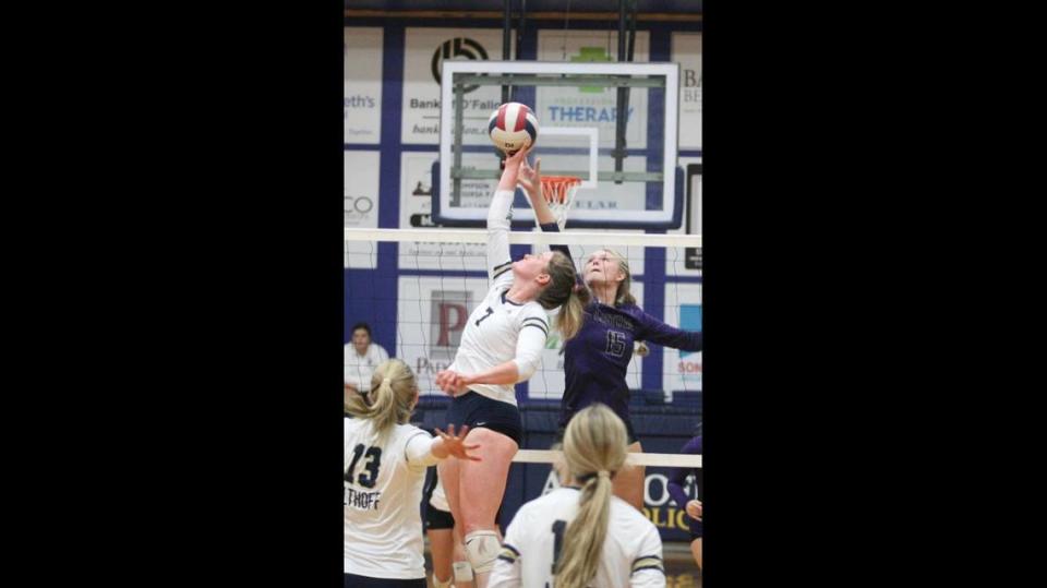 This file photo shows Gabby Orlet, left, during a volleyball match as a sophomore.