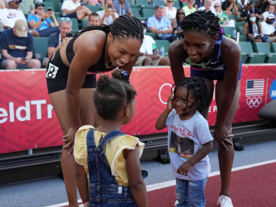 Allyson Felix (left) and Qunaera Hayes introduce their children after qualifying for the Tokyo Olympics.