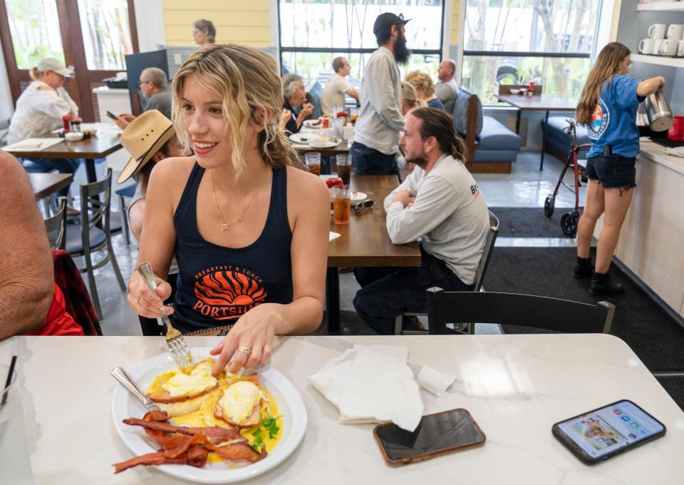 Darien Wallace has breakfast at Portside Breakfast & Lunch restaurant in West Palm Beach, Florida on November 17, 2022.