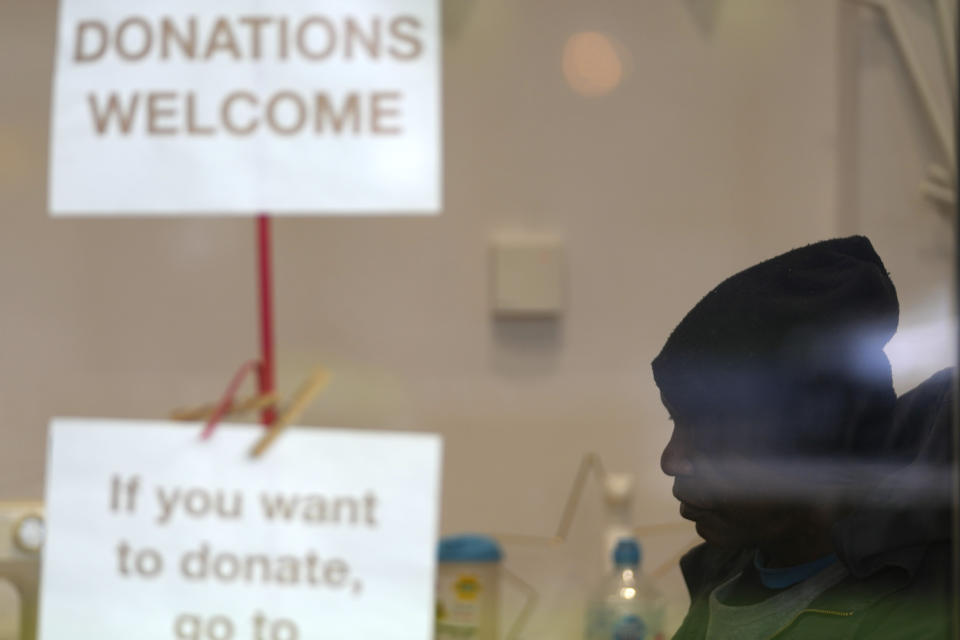 Local resident Dave sits at the Community Food Hub in London, Wednesday, May 4, 2022. Across Britain, food banks and community food hubs that helped struggling families, older people and the homeless during the pandemic are now seeing soaring demand. The cost of food and fuel in the U.K. has risen sharply since late last year, with inflation reaching the highest level in 40 years. (AP Photo/Frank Augstein)