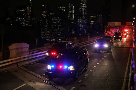 A convoy of law enforcement vehicles transporting Joaquin Guzman, the Mexican drug lord known as "El Chapo", crosses the Brooklyn Bridge heading to the Brooklyn Federal Courthouse for his trial in the Brooklyn borough of New York, U.S., February 11, 2019. REUTERS/Brendan McDermid