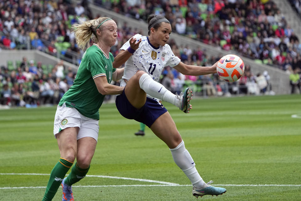 United States forward Sophia Smith (11) keeps the ball away from Ireland defender Louise Quinn (4) during the first half of an international friendly soccer match in Austin, Texas, Saturday, April 8, 2023. (AP Photo/Eric Gay)