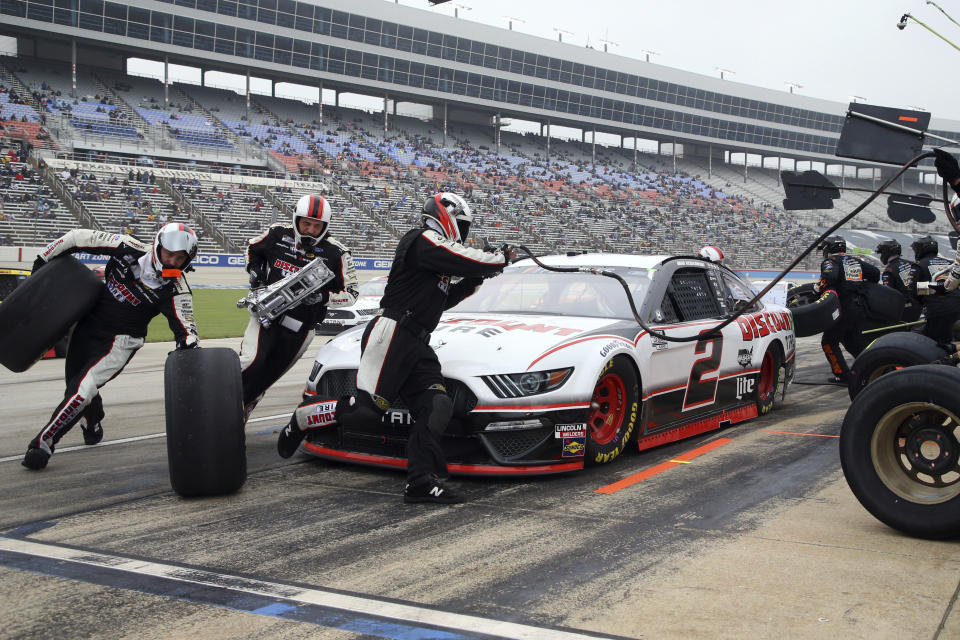 Brad Keselowski (2) pits during a caution at a NASCAR Cup Series auto race at Texas Motor Speedway in Fort Worth, Texas, Sunday, Oct. 25, 2020. (AP Photo/Richard W. Rodriguez)