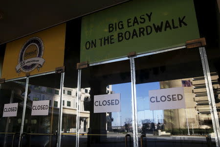 The doors to the Showboat Casino, that operated from 1987 to 2014, are marked with "closed" signs in Atlantic City, New Jersey, January 19, 2016. REUTERS/Shannon Stapleton