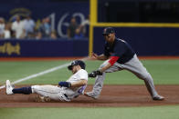 Tampa Bay Rays' Brandon Lowe beats the tag of Boston Red Sox third baseman Rafael Devers, advancing on a single by Ji-Man Choi during the third inning of a baseball game Saturday, July 31, 2021, in St. Petersburg, Fla. (AP Photo/Scott Audette)