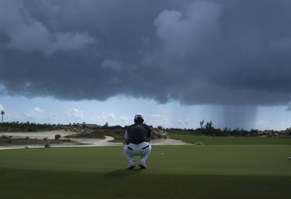 Tom Kim, of South Korea, lines up a putt on the third green during the first round of the Hero World Challenge PGA Tour at the Albany Golf Club, in New Providence, Bahamas, Thursday, Dec. 1, 2022. (AP Photo/Fernando Llano)