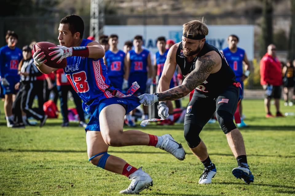 Callahan's David Price (22) makes a successful flag pull while playing for the United States against Chile at the 2021 world championships of flag football in Israel. [Provided by USA Football]