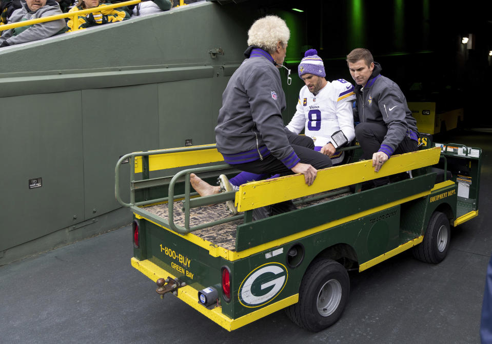 Minnesota Vikings quarterback Kirk Cousins (8) is carted off the field after sustaining an injury during the second half of an NFL football game against the Green Bay Packers, Sunday, Oct. 29, 2023, in Green Bay, Wis. (Carlos Gonzalez/Star Tribune via AP)