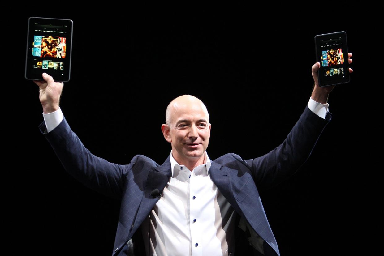 GettyImages 151364869 SANTA MONICA, CA - SEPTEMBER 6: Amazon CEO Jeff Bezos holds up the new Kindle Fire HD reading device in two sizes during a press conference on September 6, 2012 in Santa Monica, California. Amazon unveiled the Kindle Fire HD in 7 and 8.9-inch sizes, with prices starting at $199. (Photo by David McNew/Getty Images)