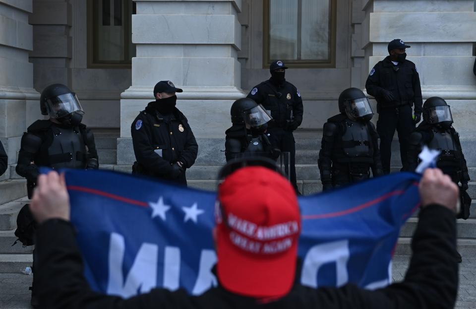 <p>Trump supporters confront police and security forces at the US Capitol</p>AFP via Getty Images