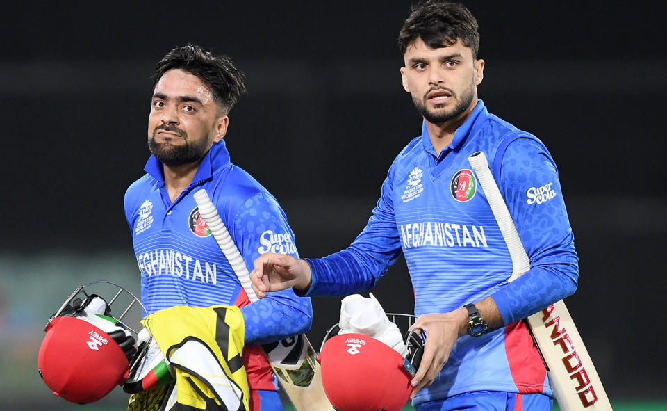 Rashid Khan and Naveen-ul-Haq, pictured here after Afghanistan's loss to Australia at the T20 World Cup.