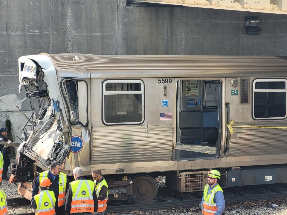 This handout photo provided by the Chicago Fire Department on Nov. 16, 2023, shows workers examining the damage to a CTA train in Chicago.