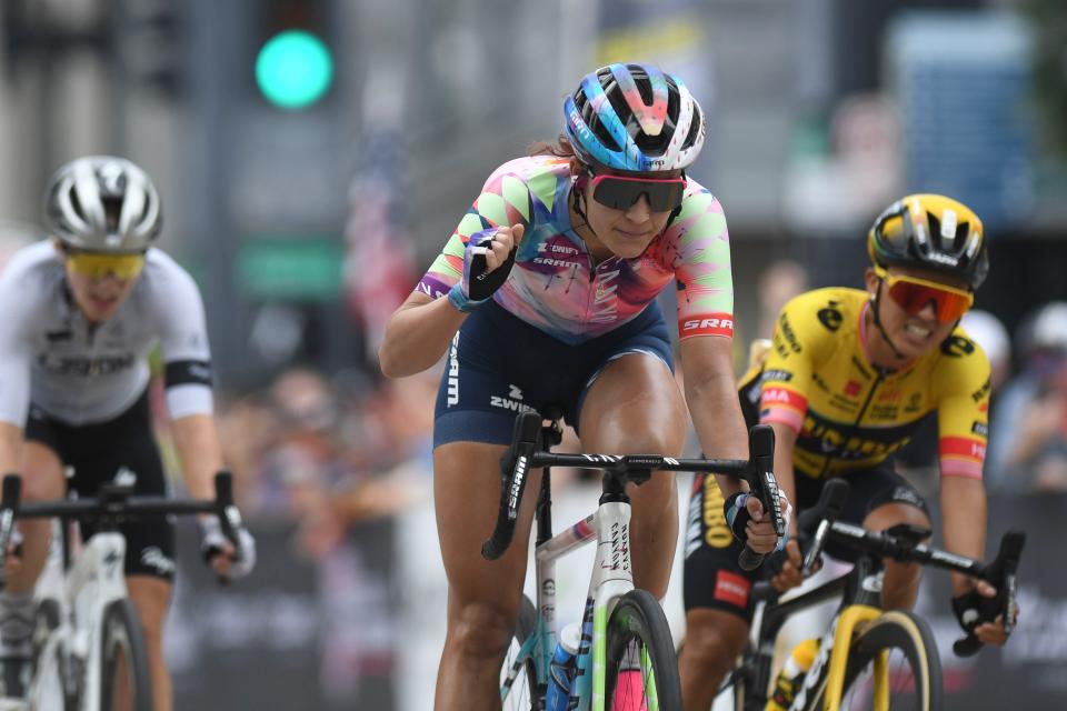 Chloe Dygert of Canon//Sram Racing raises her hand in a brief celebration as she wins the USA Cycling Pro Road National Championship in Knoxville, Tenn. Sunday, June 25, 2023. Coming in second is Coryn Labecki, right, and Skylar Schneider, left, with third.