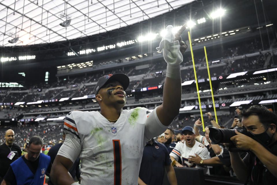 Chicago Bears quarterback Justin Fields (1) runs off the field after the Chicago Bears defeated the Las Vegas Raiders in an NFL football game, Sunday, Oct. 10, 2021, in Las Vegas. (AP Photo/David Becker)