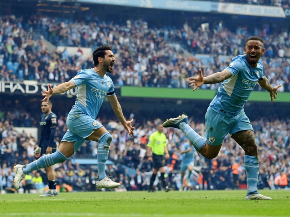 Gundogan (left) scored twice in a stunning conclusion to the game (Getty)