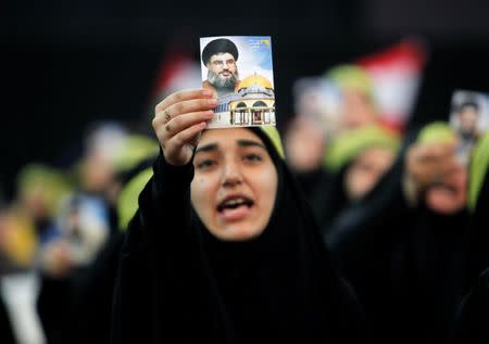 A supporter of Lebanon's Hezbollah leader Sayyed Hassan Nasrallah chants slogans and gestures during a rally marking Al-Quds day in Beirut's southern suburbs, Lebanon June 23, 2017. REUTERS/Aziz Taher