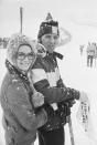 <p>American actress <strong>Natalie Wood </strong>and <strong>U.S. ski racer Billy Kidd </strong>bundle up beside one another to watch the Giant Slalom Race from which Kidd was disqualified for taking a fall. Later that day, they celebrated the premiere of Wood's beau Richard Gregoson's film <em><strong>Downhill Racer. </strong></em>The 1970 movie starred dashing actor and <strong>avid skier Robert Redford.</strong> </p>