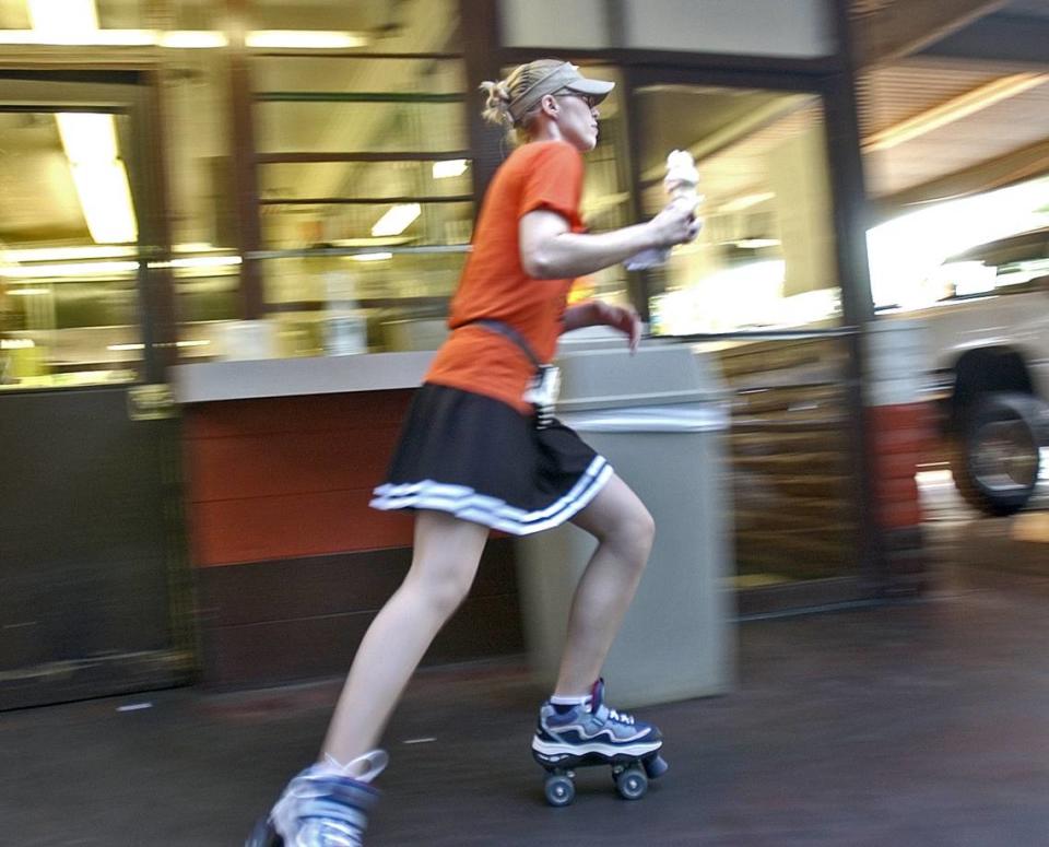 Marissa Sharver of Modesto works as a carhop at A&W Restaurant on June 22, 2004. Sharver has been working there for about four months, and says she enjoys working in roller skates. (Jeremy Rue/The Modesto Bee)