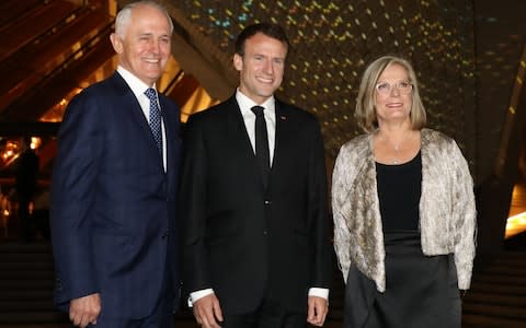 Emmanuel Macron poses with Malcolm Turnbull and his wife Lucy Turnbull outside the Sydney Opera House  - Credit:  AFP