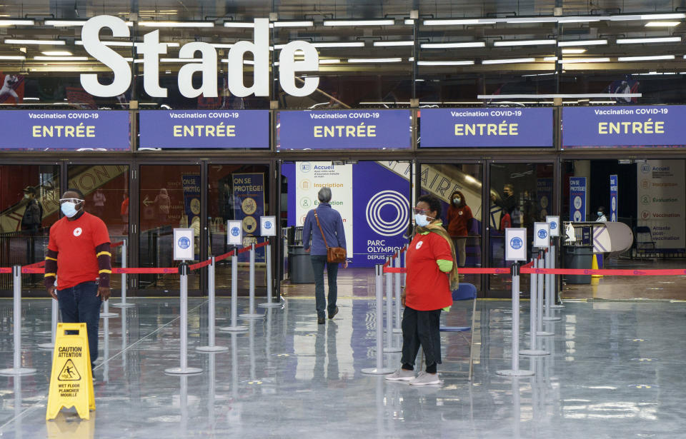 A lone patient enters a COVID-19 vaccination clinic during the coronavirus pandemic at Olympic Stadium in Montreal, on Wednesday, April 7, 2021. (Paul Chiasson/The Canadian Press via AP)