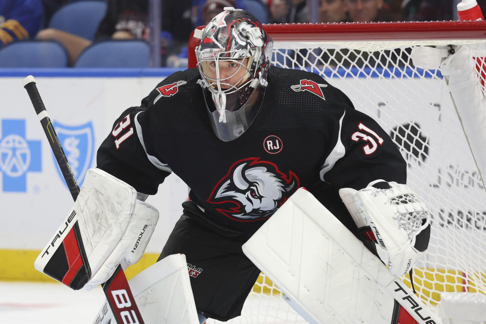 Buffalo Sabres goaltender Eric Comrie (31) keeps his eyes on the puck during the second period of an NHL hockey game against the New York Islanders Saturday, Oct. 21, 2023, in Buffalo, N.Y. (AP Photo/Jeffrey T. Barnes)