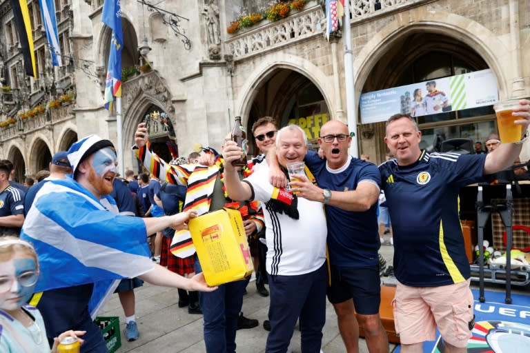 Supporters of Scotland's and <a class="link " href="https://sports.yahoo.com/soccer/teams/germany-women/" data-i13n="sec:content-canvas;subsec:anchor_text;elm:context_link" data-ylk="slk:Germany;sec:content-canvas;subsec:anchor_text;elm:context_link;itc:0">Germany</a>'s national football teams in Munich ahead of the Euros opener (Michaela STACHE)