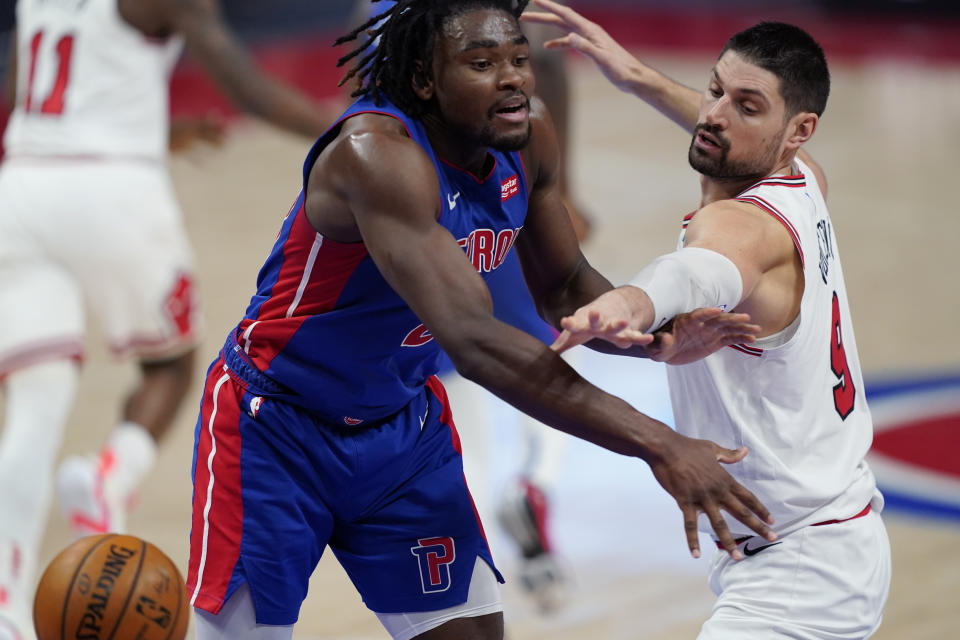 Chicago Bulls center Nikola Vucevic (9) knocks the ball away from Detroit Pistons center Isaiah Stewart during the second half of an NBA basketball game, Sunday, May 9, 2021, in Detroit. (AP Photo/Carlos Osorio)