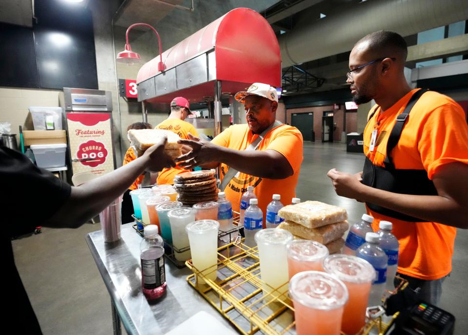 Vendor Derrick Moore prepares to make his rounds with lemonade and snacks at Chase Field.