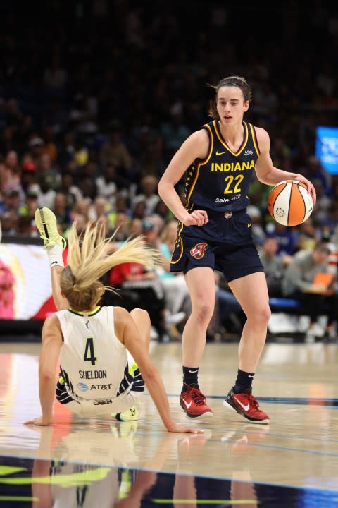 ARLINGTON, TEXAS – MAY 03: Caitlin Clark #22 of the Indiana Fever drives against <a class="link " href="https://sports.yahoo.com/wnba/players/10034/" data-i13n="sec:content-canvas;subsec:anchor_text;elm:context_link" data-ylk="slk:Jacy Sheldon;sec:content-canvas;subsec:anchor_text;elm:context_link;itc:0">Jacy Sheldon</a> #4 of the <a class="link " href="https://sports.yahoo.com/wnba/teams/dallas/" data-i13n="sec:content-canvas;subsec:anchor_text;elm:context_link" data-ylk="slk:Dallas Wings;sec:content-canvas;subsec:anchor_text;elm:context_link;itc:0">Dallas Wings</a> at College Park Center on May 03, 2024 in Arlington, Texas. (Photo by Gregory Shamus/Getty Images)