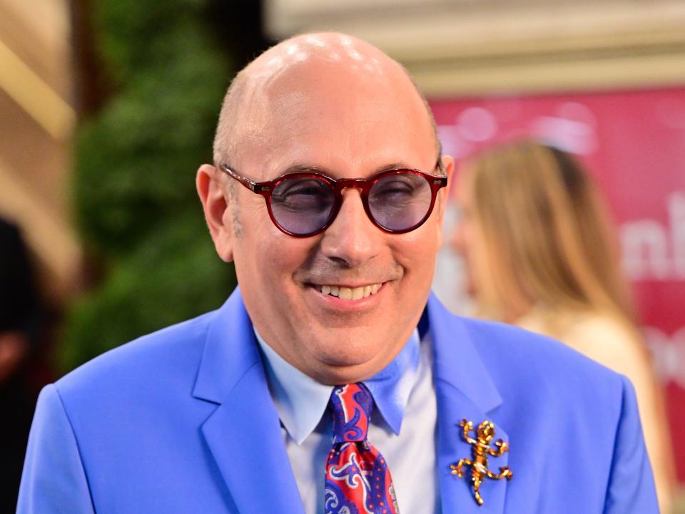 Willie Garson on the set of "And Just Like That..." in a brightly colored suit and tie.