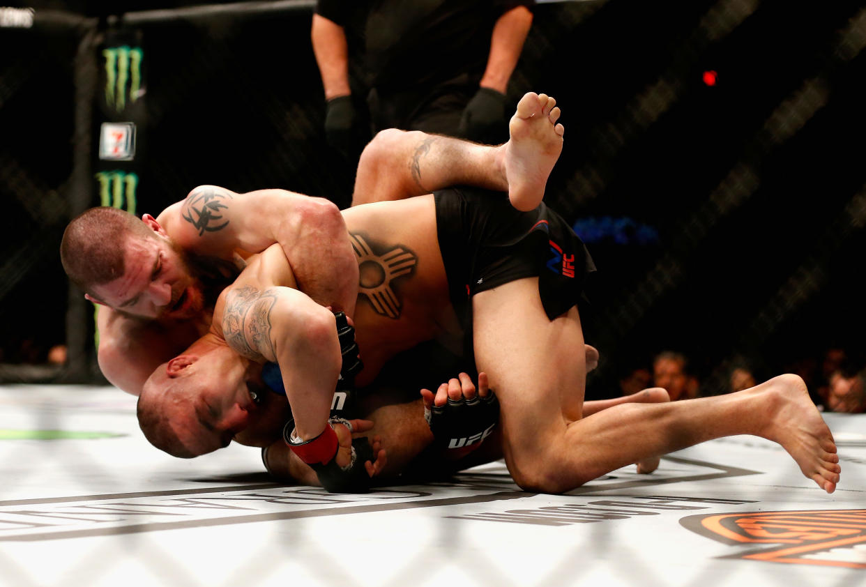 LAS VEGAS, NV - MARCH 05: Jim Miller (top) grapples with Diego Sanchez in their lightweight bout during the UFC 196 event inside MGM Grand Garden Arena on March 5, 2016 in Las Vegas, Nevada.  (Photo by Christian Petersen/Zuffa LLC/Zuffa LLC via Getty Images)