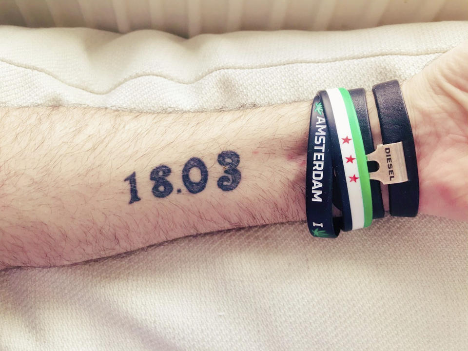 This photo provided by Syrian opposition activist Nedal al-Amari and taken near Cologne, Germany, on March 11, 2021, shows a tattoo on al-Amari's arm with the date of the first large protest in his hometown of Daraa, Syria: March 18. Al-Amari was among the first to join the protests against the Assad family rule amid Arab Spring uprisings in 2011. (Nedal al-Amari via AP)