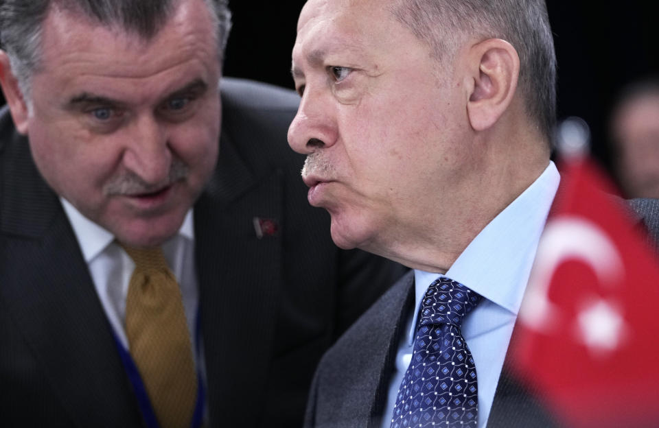 Turkish President Recep Tayyip Erdogan, right, during a round table meeting at a NATO summit in Madrid, Spain on Thursday, June 30, 2022. North Atlantic Treaty Organization heads of state will meet for the final day of a NATO summit in Madrid on Thursday. (AP Photo/Bernat Armangue)