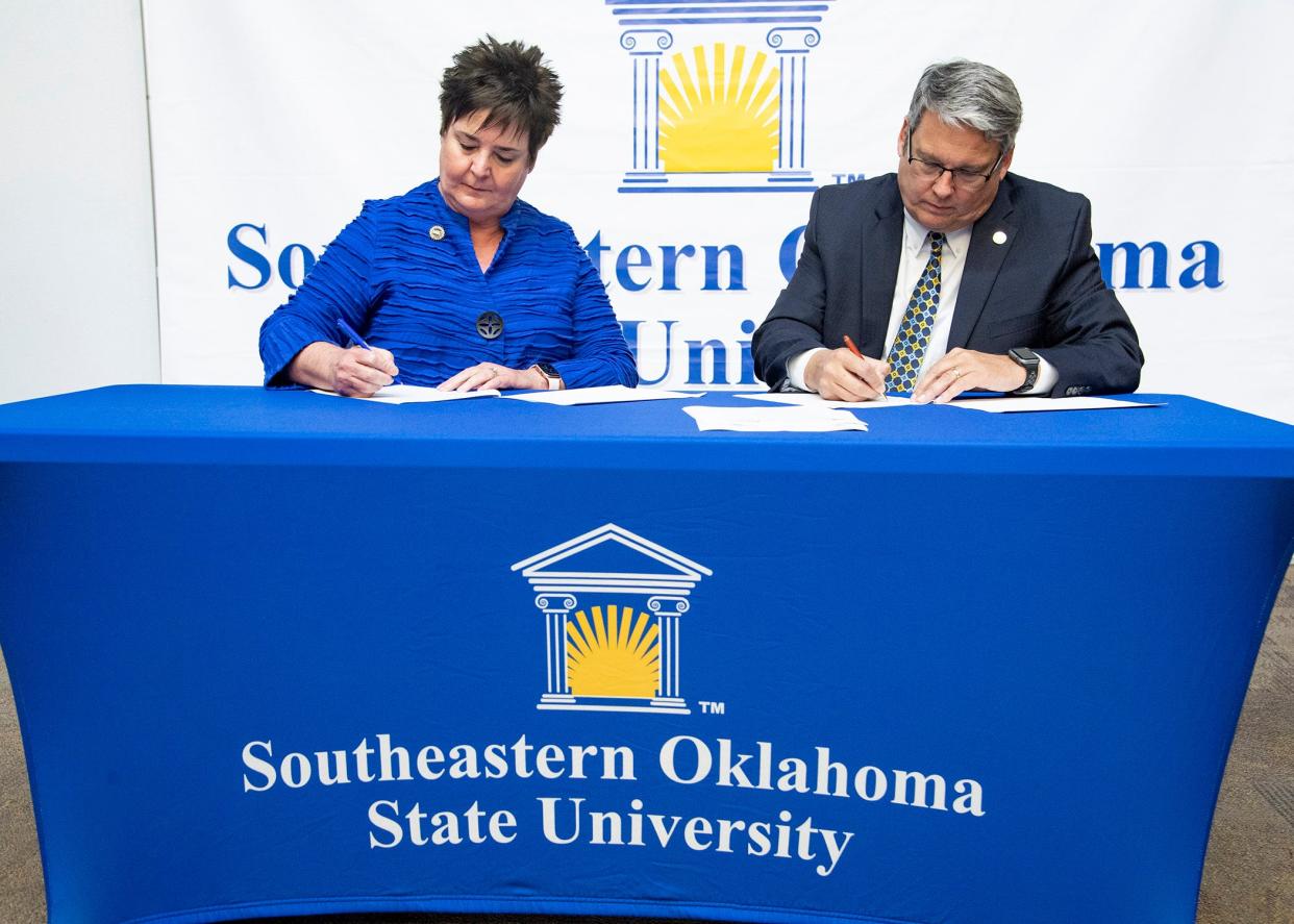 Murray State College president Joy McDaniel and Southeastern president Thomas Newsom sign the agreement to bring the nursing program to Durant.