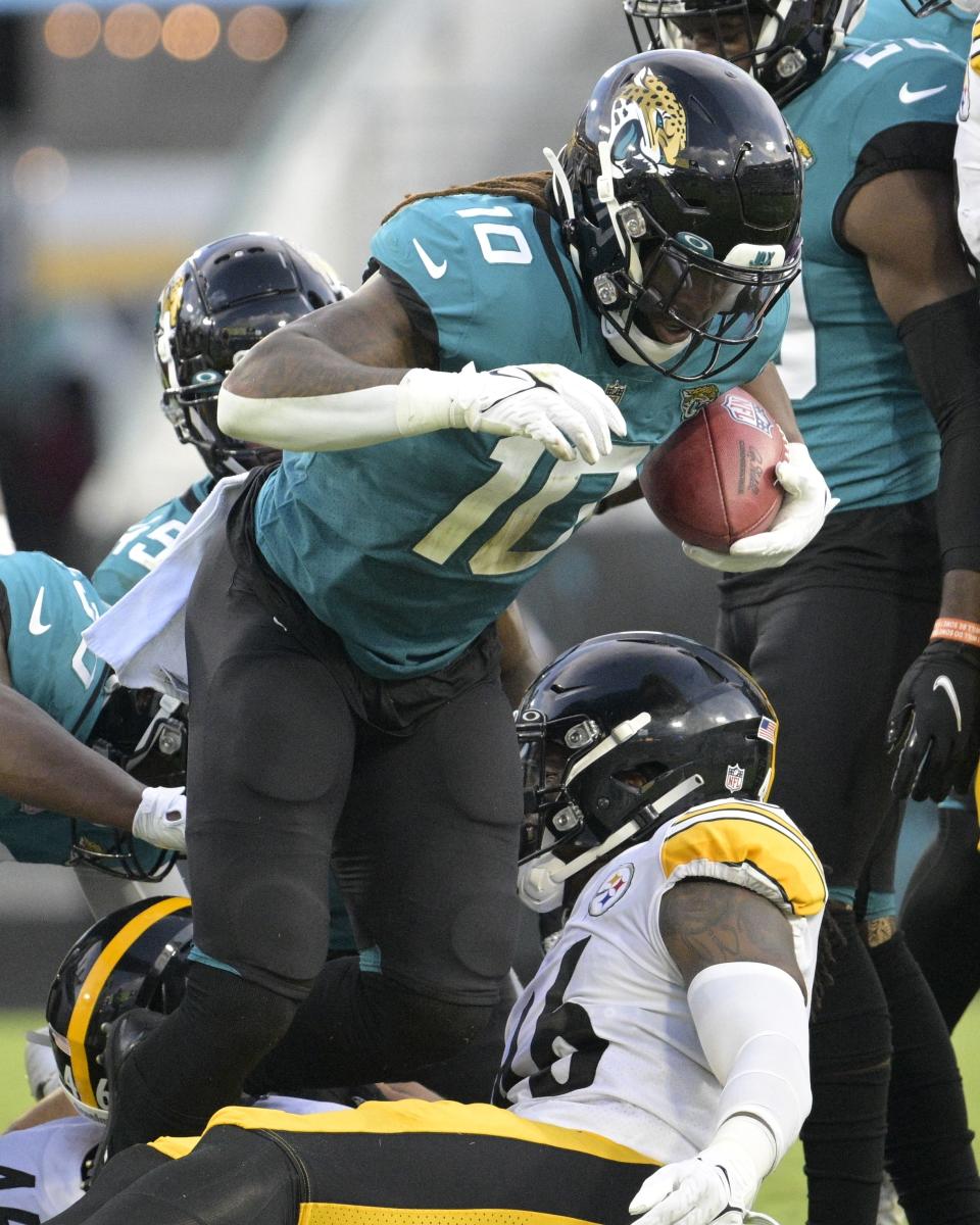 Jacksonville Jaguars wide receiver Laviska Shenault Jr. (10) recovers a fumble on a Pittsburgh Steelers punt return during the first half of an NFL preseason football game, Saturday, Aug. 20, 2022, in Jacksonville, Fla. (AP Photo/Phelan M. Ebenhack)