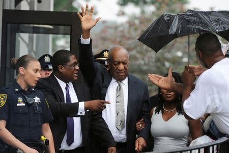 FILE PHOTO - Actor and comedian Bill Cosby (C) waves as he departs after a judge declared a mistrial in his sexual assault trial at the Montgomery County Courthouse in Norristown, Pennsylvania, U.S., June 17, 2017. REUTERS/Charles Mostoller