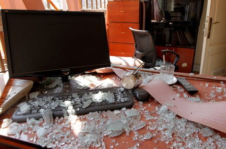 Damage and glass from broken windows are seen inside Hezbollah media center after an Israeli drone fell in the Hezbollah-dominated southern suburbs and a second one exploded near the ground in Dahiyeh suburbs of Beirut