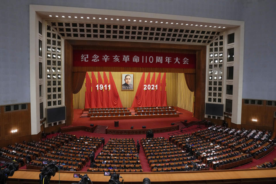 Chinese President Xi Jinping, center on the stage, delivers a speech at an event commemorating the 110th anniversary of Xinhai Revolution at the Great Hall of the People in Beijing, Saturday, Oct. 9, 2021. (AP Photo/Andy Wong)