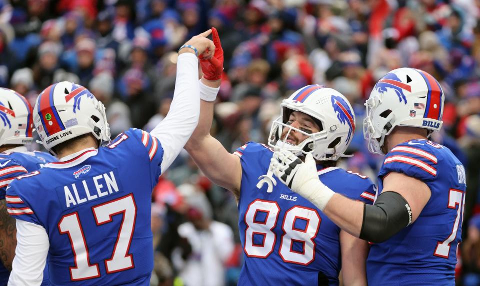 Bills tight end Dawson Knox celebrates his touchdown catch with quarterback Josh Allen.