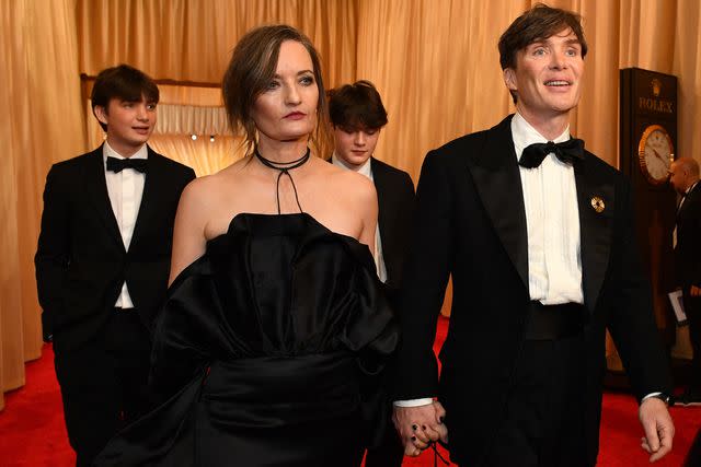 <p>VALERIE MACON/AFP via Getty </p> Cillian Murphy arrives with his wife and sons at the 2024 Oscars.