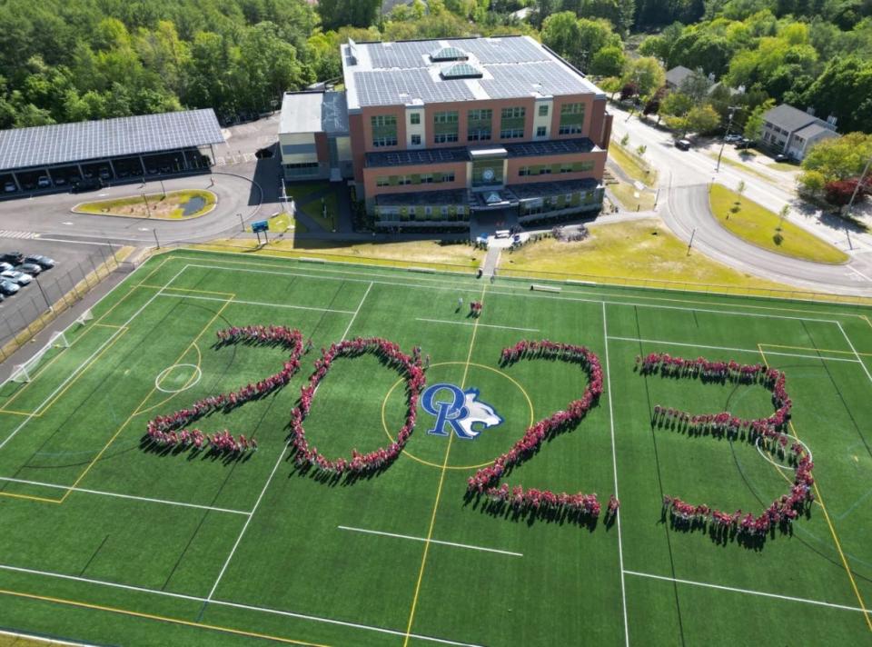 Oyster River Middle School students gather on the athletic field to spell out the year 2023 to commemorate the annual Service Palooza.